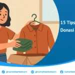 Seorang wanita sedang menyerahkan pakaian bekas ke dalam kotak donasi, menggambarkan aksi donasi pakaian bekas.